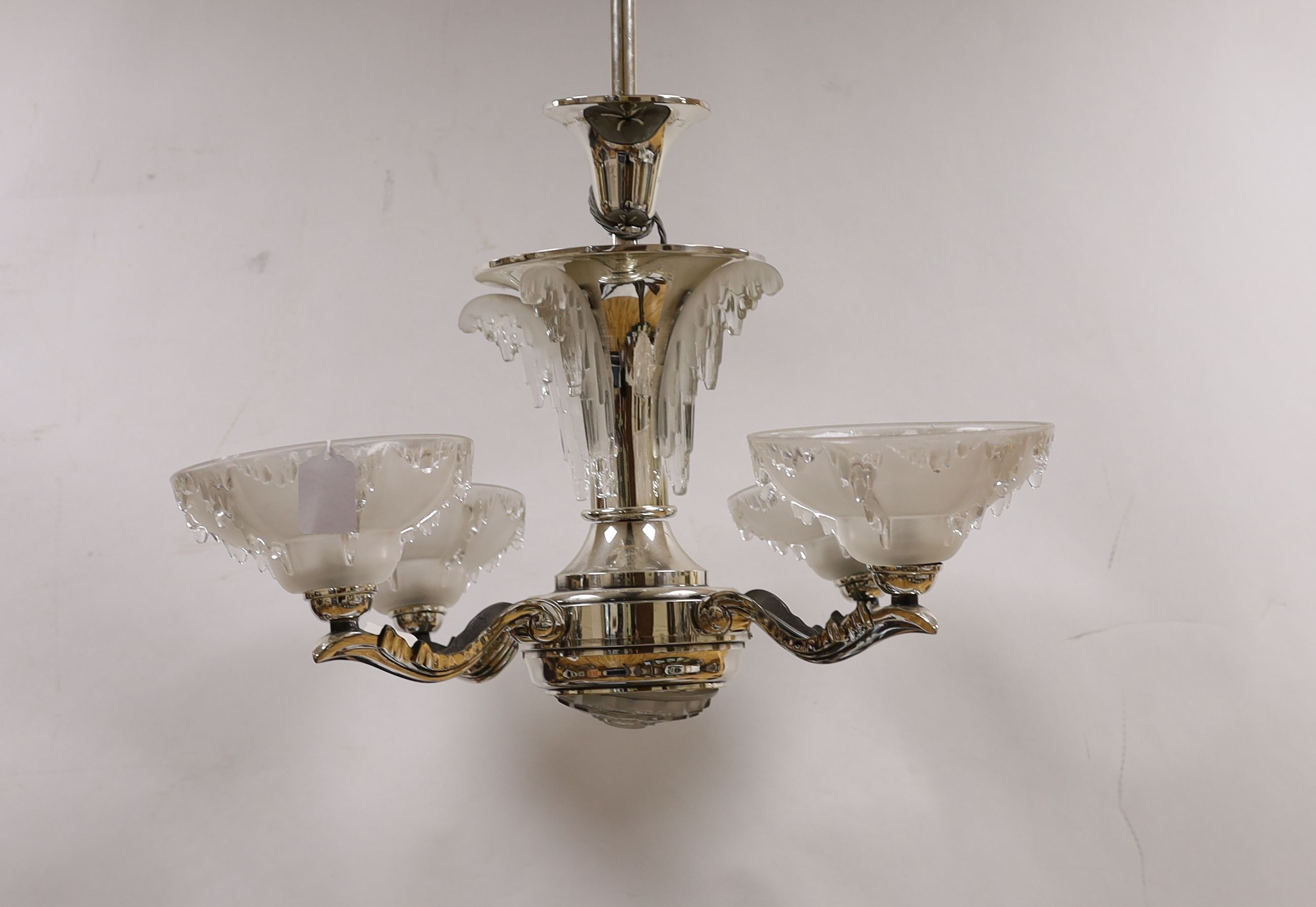 A chrome Art Deco 4 branch electrolier, with frosted glass shades, 77 cms high.